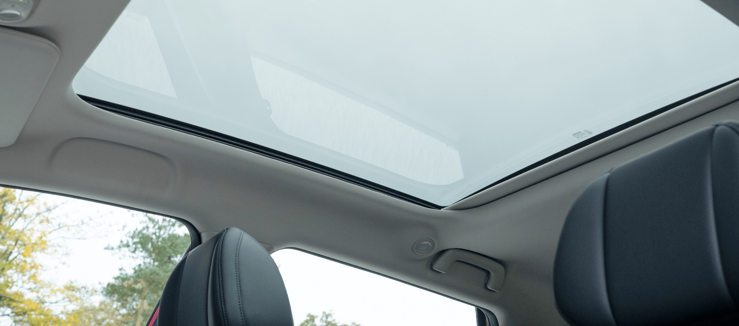 Stay connected with the outside world through an ultra-large sunroof with electric sunshade you control.